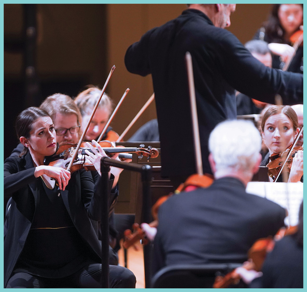 Concertmaster Stefani Matsuo (left) focuses on Louis Langrée during a recent CSO concert. Credit: Mark Lyons 